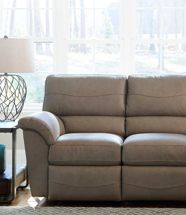 Room scene with leather cover on Reese Reclining Sofa