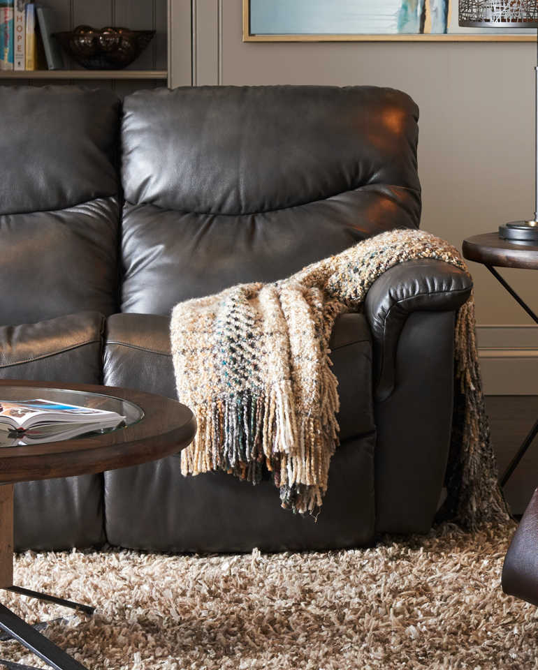 Closeup of James Reclining Sofa with leather cover